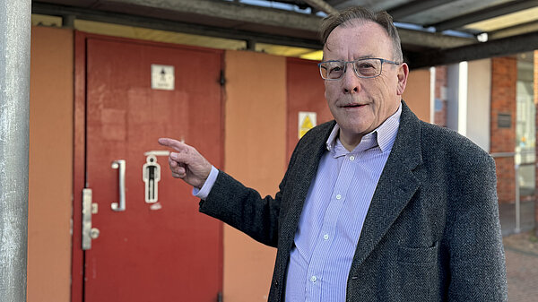 Tom Cornwall in front of New Street Toilets